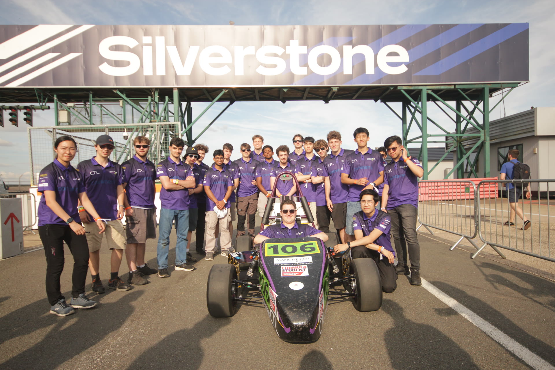 Charles and the University of Manchester Formula Student team with the car at Silverstone